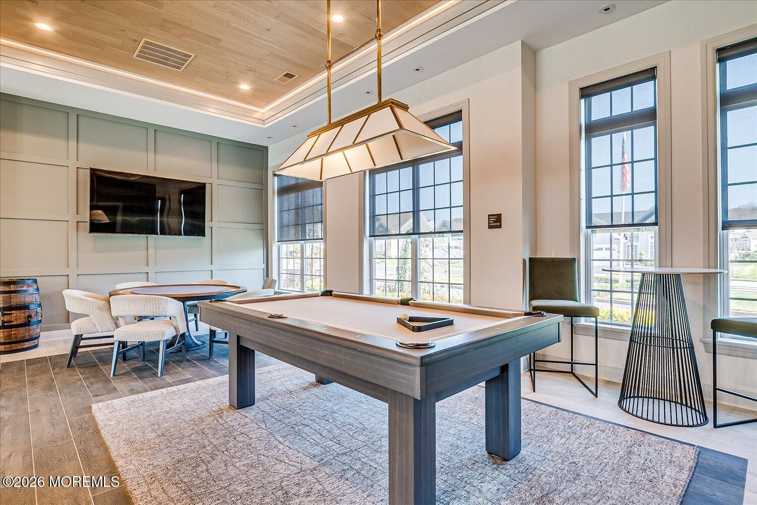 9 Militia Hill Road Freehold, NJ 07728 - Photo 57 of 67 a living room with furniture a flat screen tv and a table