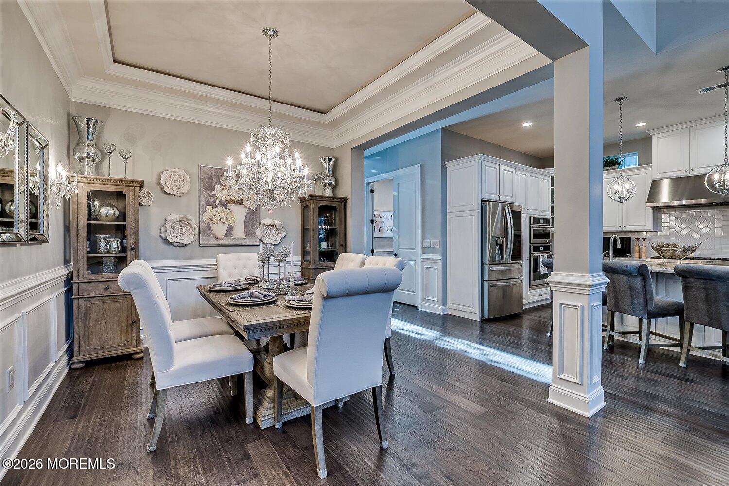 9 Militia Hill Road Freehold, NJ 07728 - Photo 10 of 67 a dining room with furniture a chandelier and wooden floor