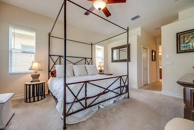 a bedroom with furniture and window