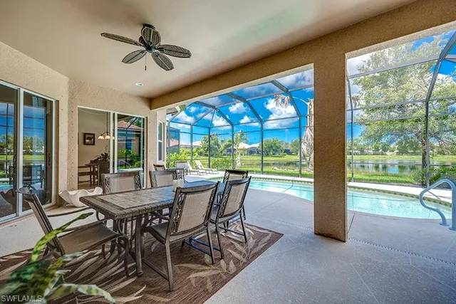 a dining room with furniture window and outside view
