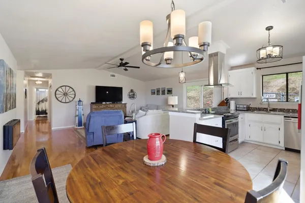 a kitchen with a stove oven and sink