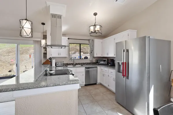 a kitchen with appliances cabinets and a sink