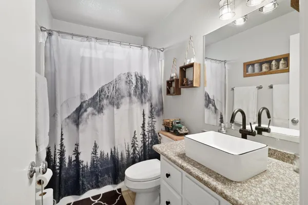 a aerial view of a house with swimming pool garden and lake view