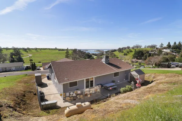 an aerial view of residential houses with outdoor space