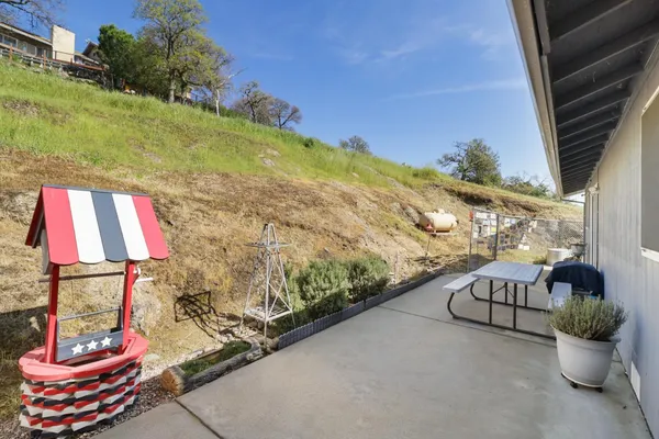 a view of a wooden deck with a backyard