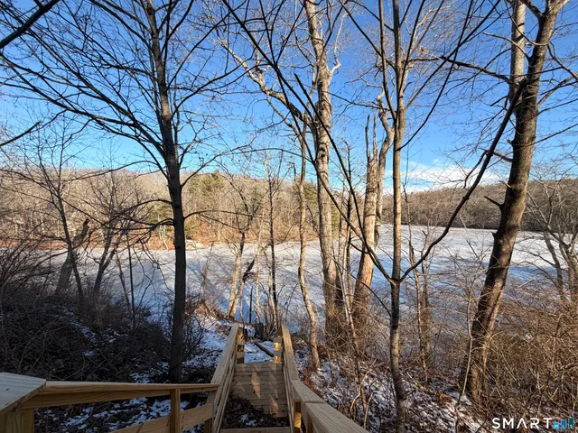 a view of tree in front of a house
