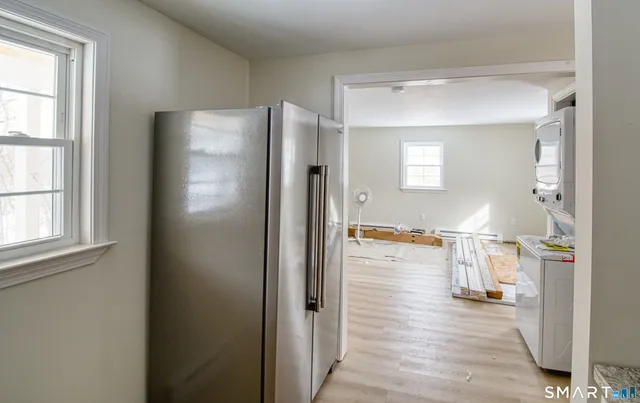 a view of a living room and a wooden floor