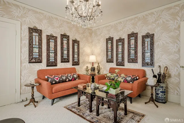 a living room with furniture flowerpot and window