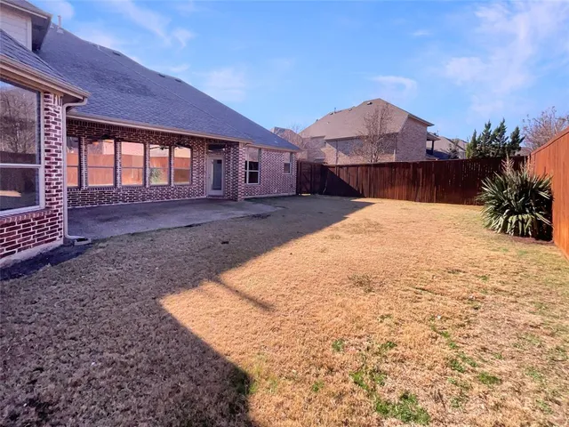 a house view with a backyard space