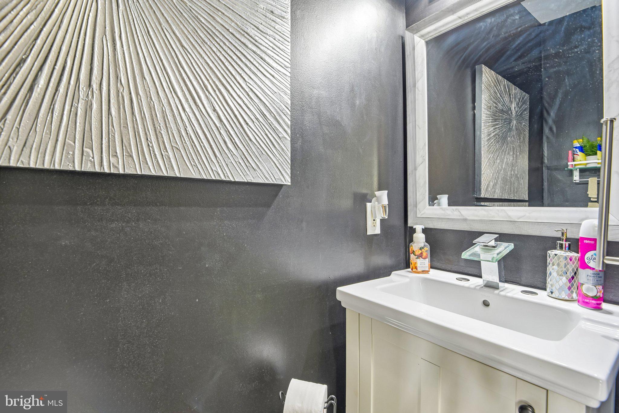 306 Watertons Way Joppa, MD 21085 - Photo 20 of 50 a bathroom with a sink and a mirror
