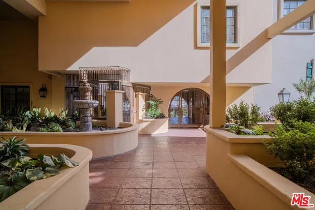 a view of a couches and table in the balcony