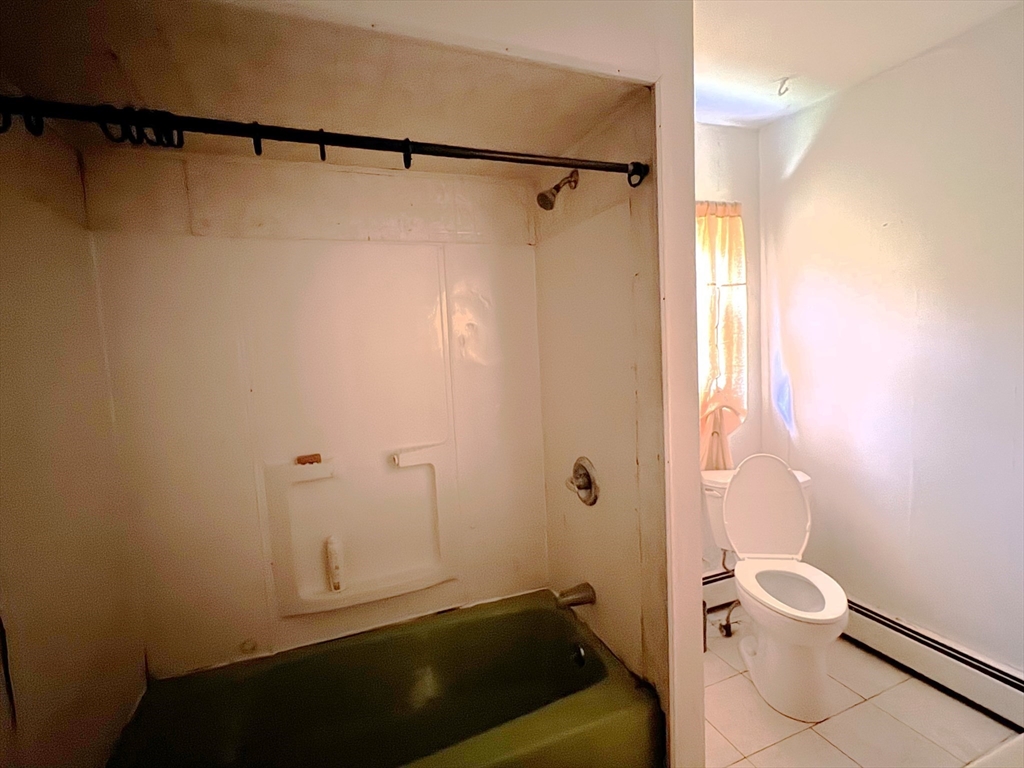 27 High Street Sturbridge, MA 01518 - Photo 12 of 17 a bathroom with a sink a toilet a shower and a bathtub