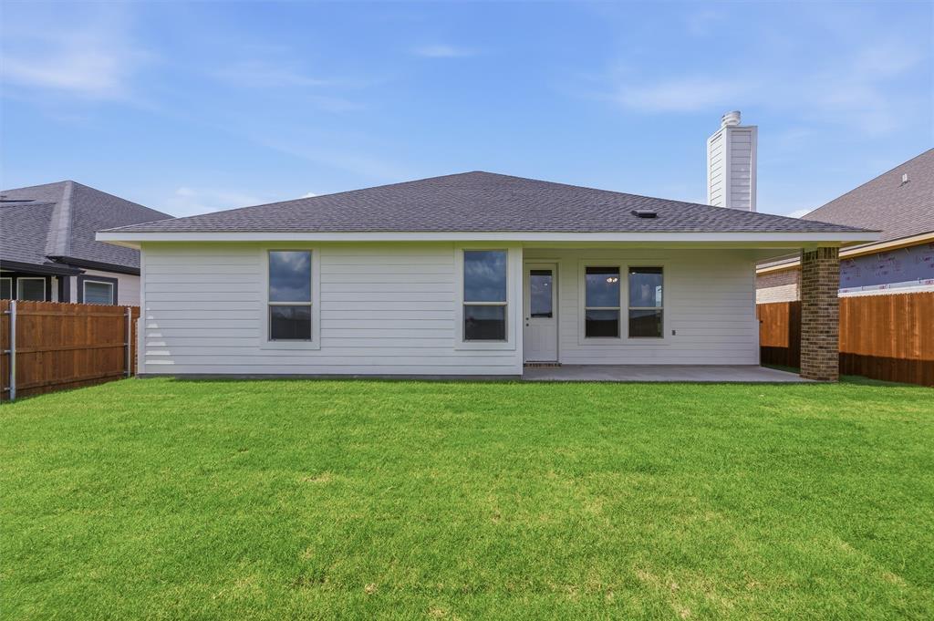 1209 Colca Drive Springtown, TX 76082 - Photo 22 of 24 Expansive green lawn with a white horizontal siding exterior