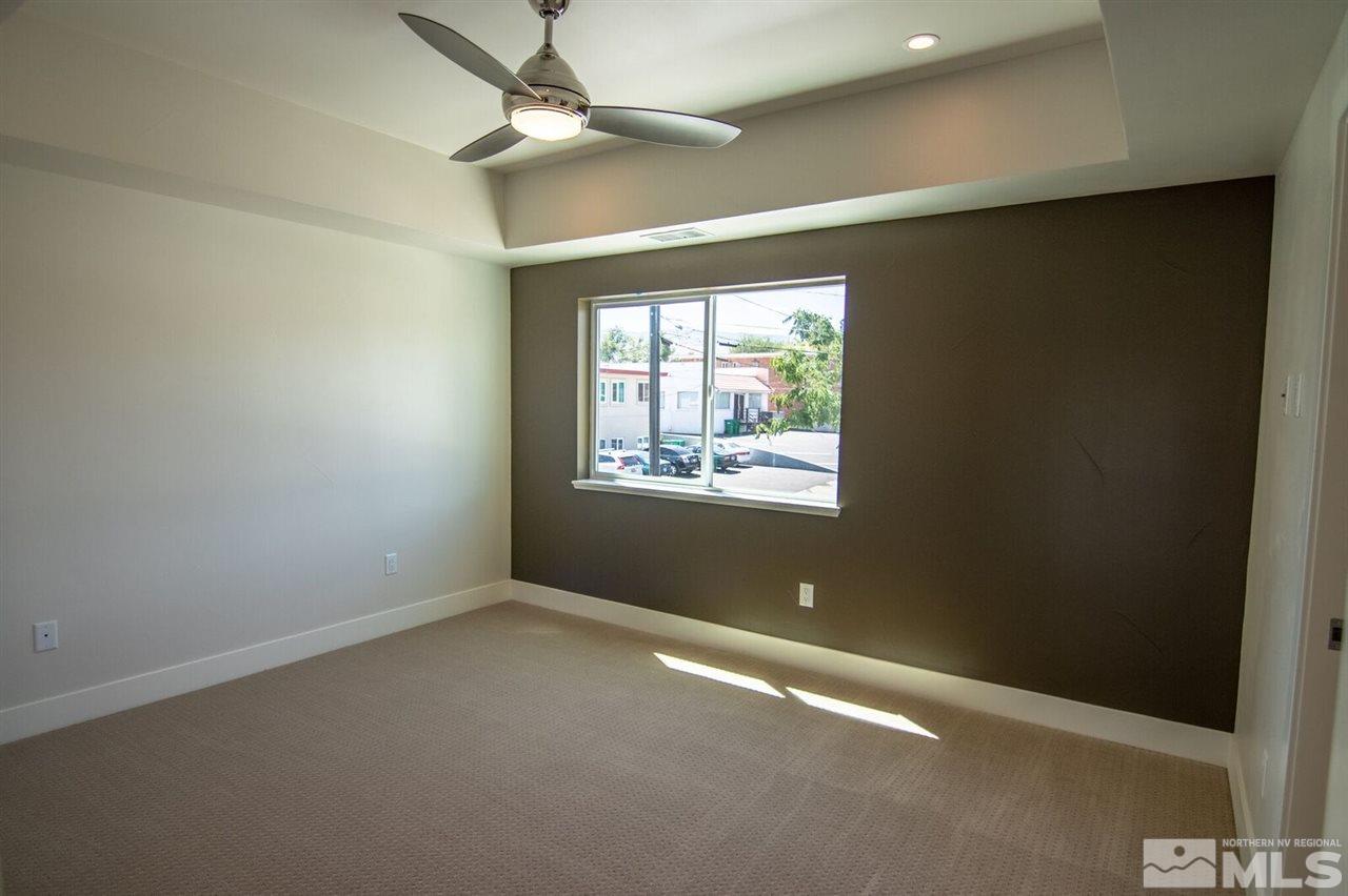 1412 Tonopah Street Reno, NV 89509 - Photo 13 of 17 an empty room with a window and ceiling fan