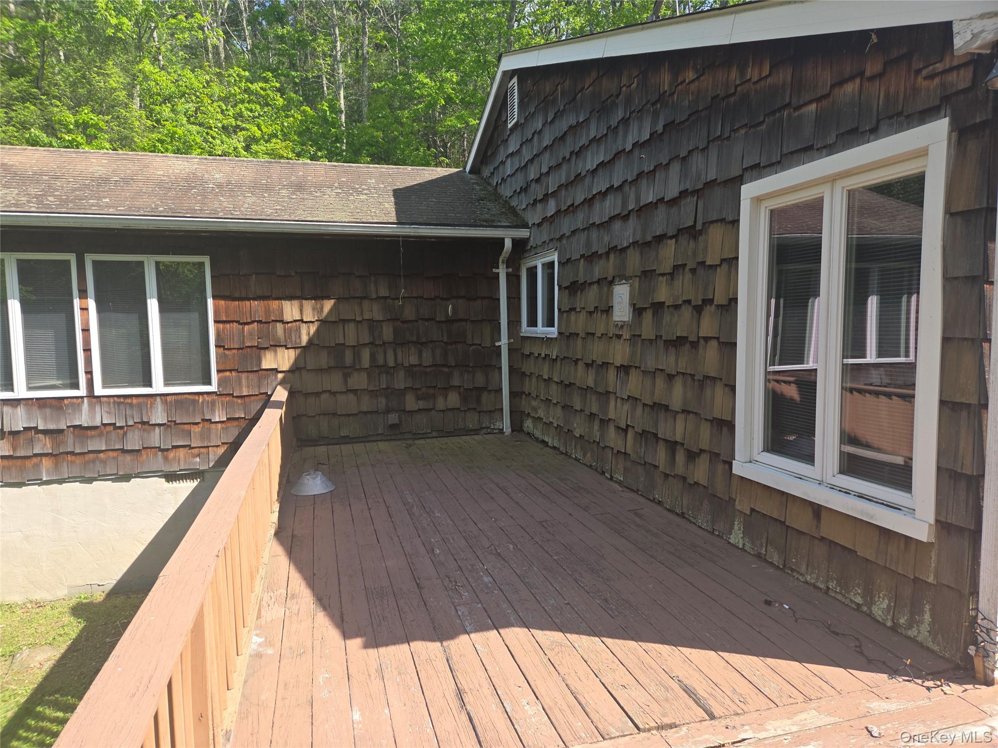 63 Otens Road Ellenville, NY 12428 - Photo 24 of 32 a view of a house with wooden floor and a window