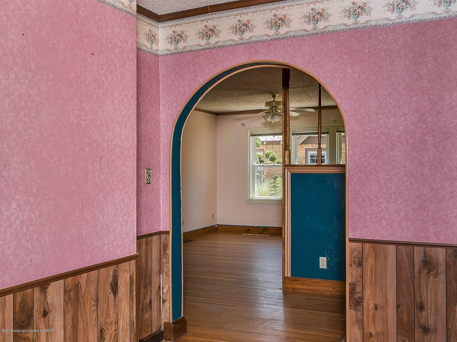 1227 South Bonham Street Amarillo, TX 79102 - Photo 12 of 25 a view of wooden staircase with a wooden door