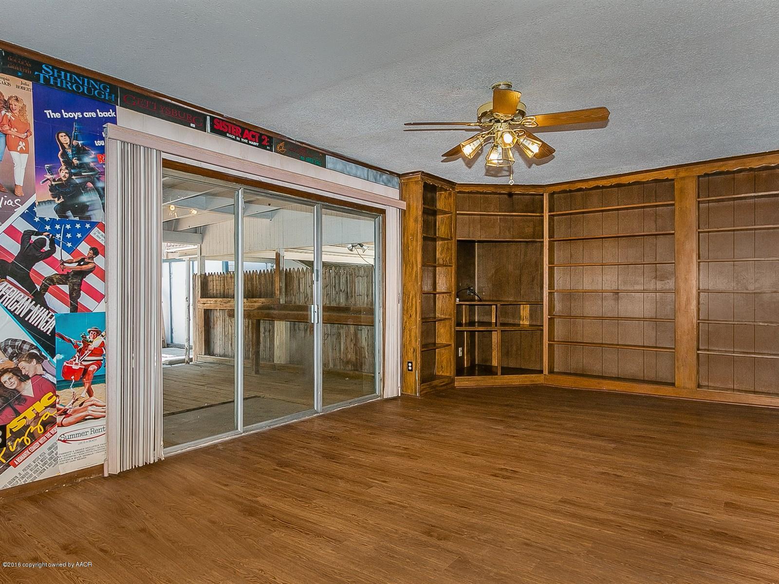 1227 South Bonham Street Amarillo, TX 79102 - Photo 13 of 25 wooden floor in an empty room with a window