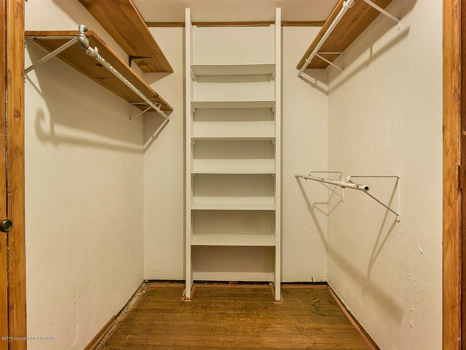 1227 South Bonham Street Amarillo, TX 79102 - Photo 17 of 25 a view of walk in closet with empty racks