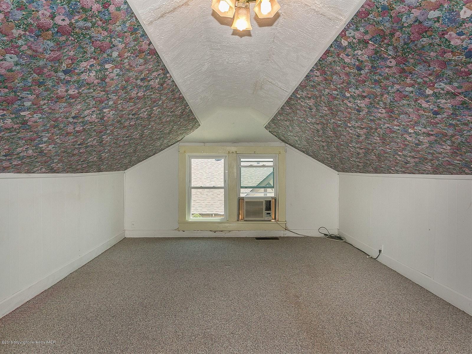 1227 South Bonham Street Amarillo, TX 79102 - Photo 20 of 25 wooden floor in an empty room with a window