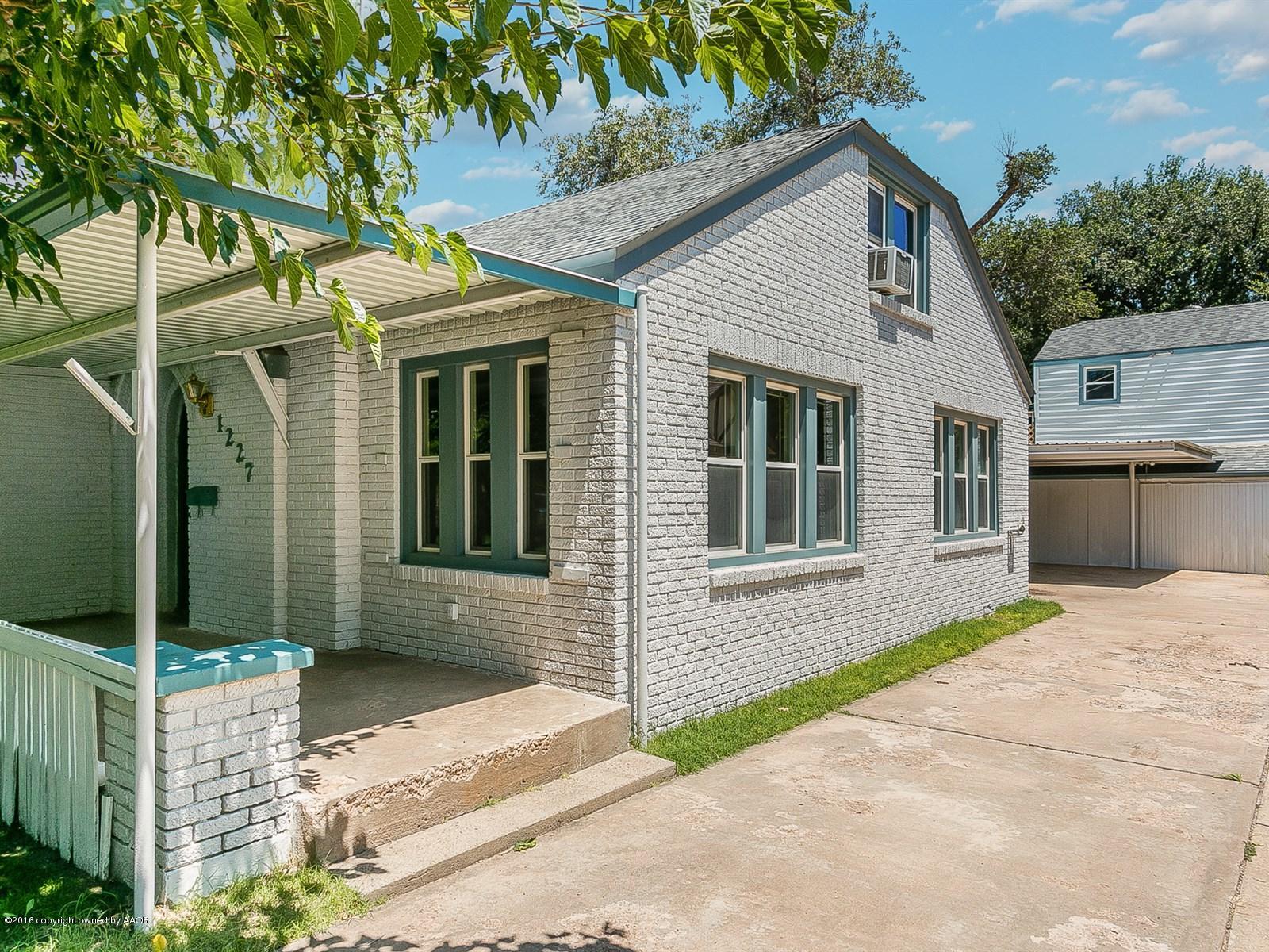 1227 South Bonham Street Amarillo, TX 79102 - Photo 2 of 25 a front view of a house with a garage
