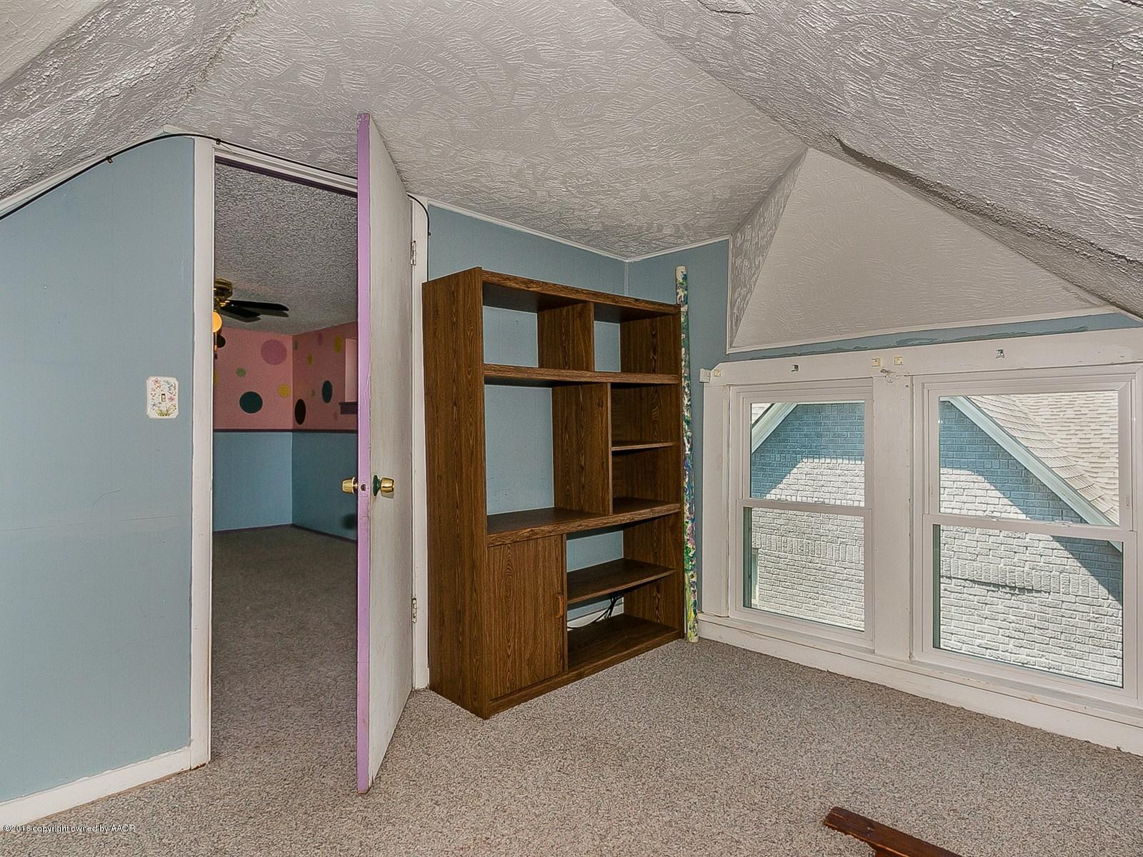 1227 South Bonham Street Amarillo, TX 79102 - Photo 21 of 25 wooden floor and closet in a room