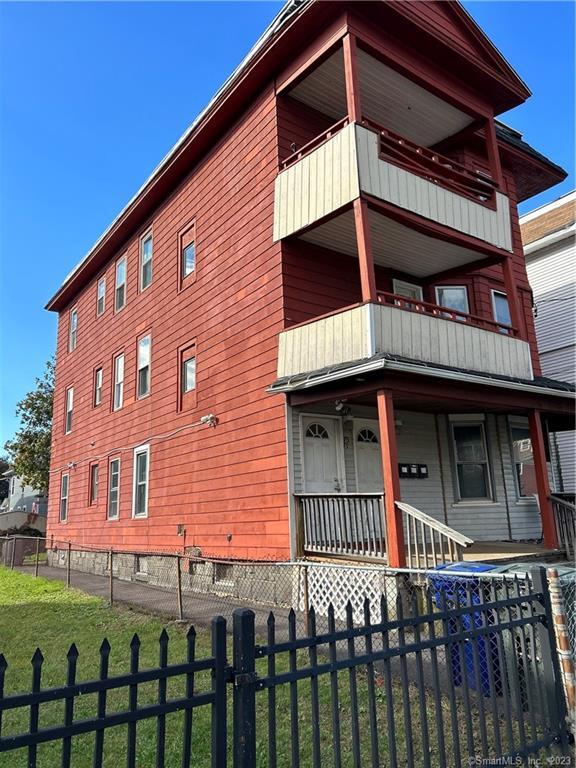 71-75 6th Street Bridgeport, CT 06607 - Photo 1 of 1 a front view of a house with glass windows