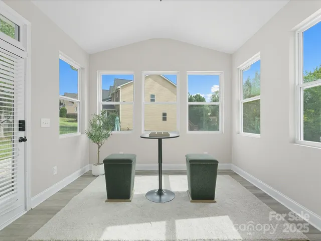 a room with a window and furniture