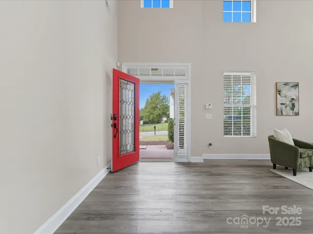 a view of an entryway with wooden floor