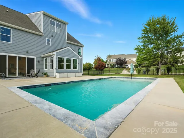 a view of a house with swimming pool