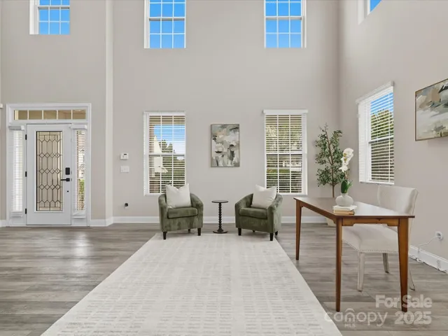 a view of a livingroom with furniture and window