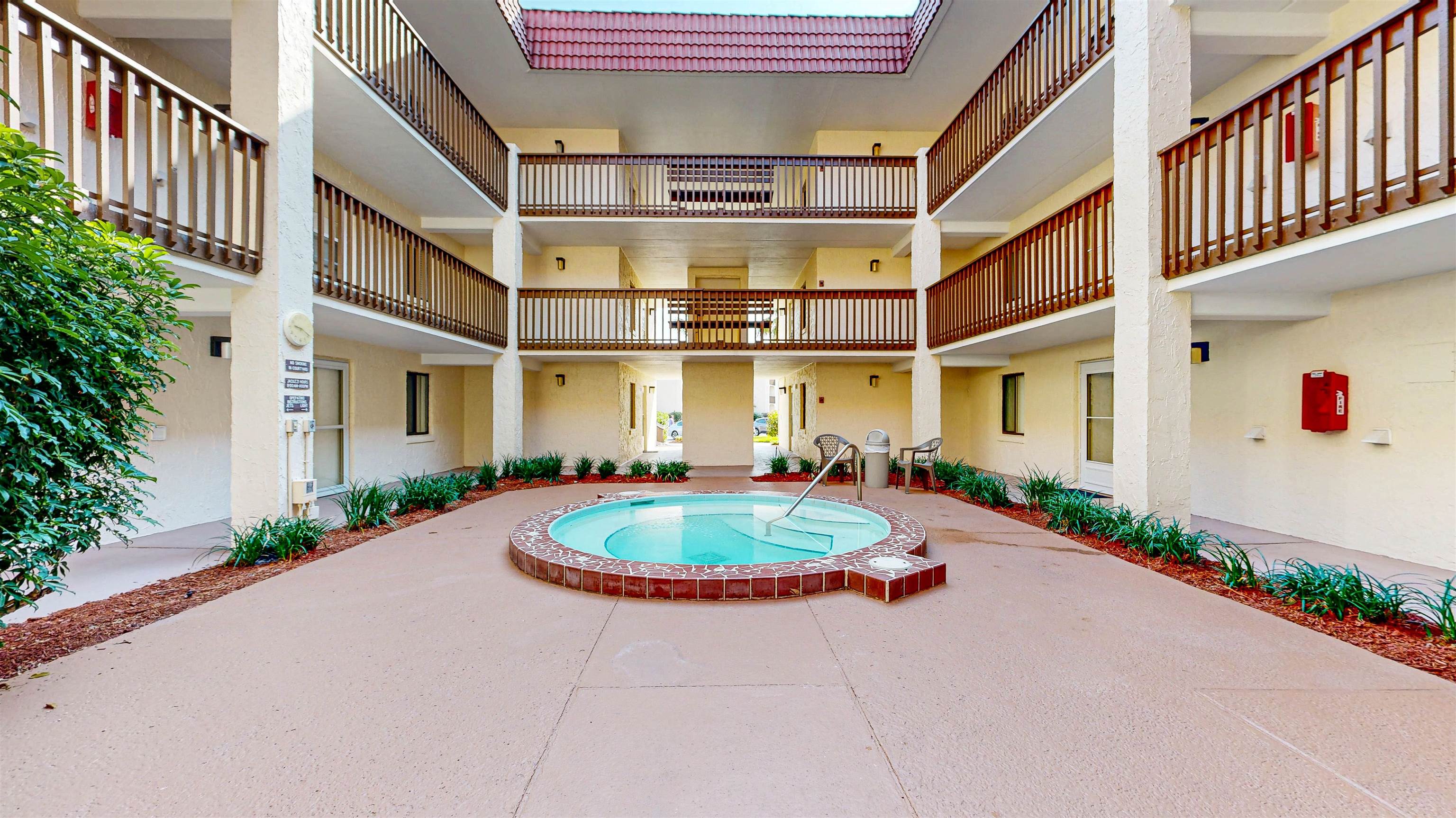 880 A1A Beach Boulevard, Unit 6101 St. Augustine, FL 32080 - Photo 15 of 21 a front view of a multi story residential apartment building with yard and sign board