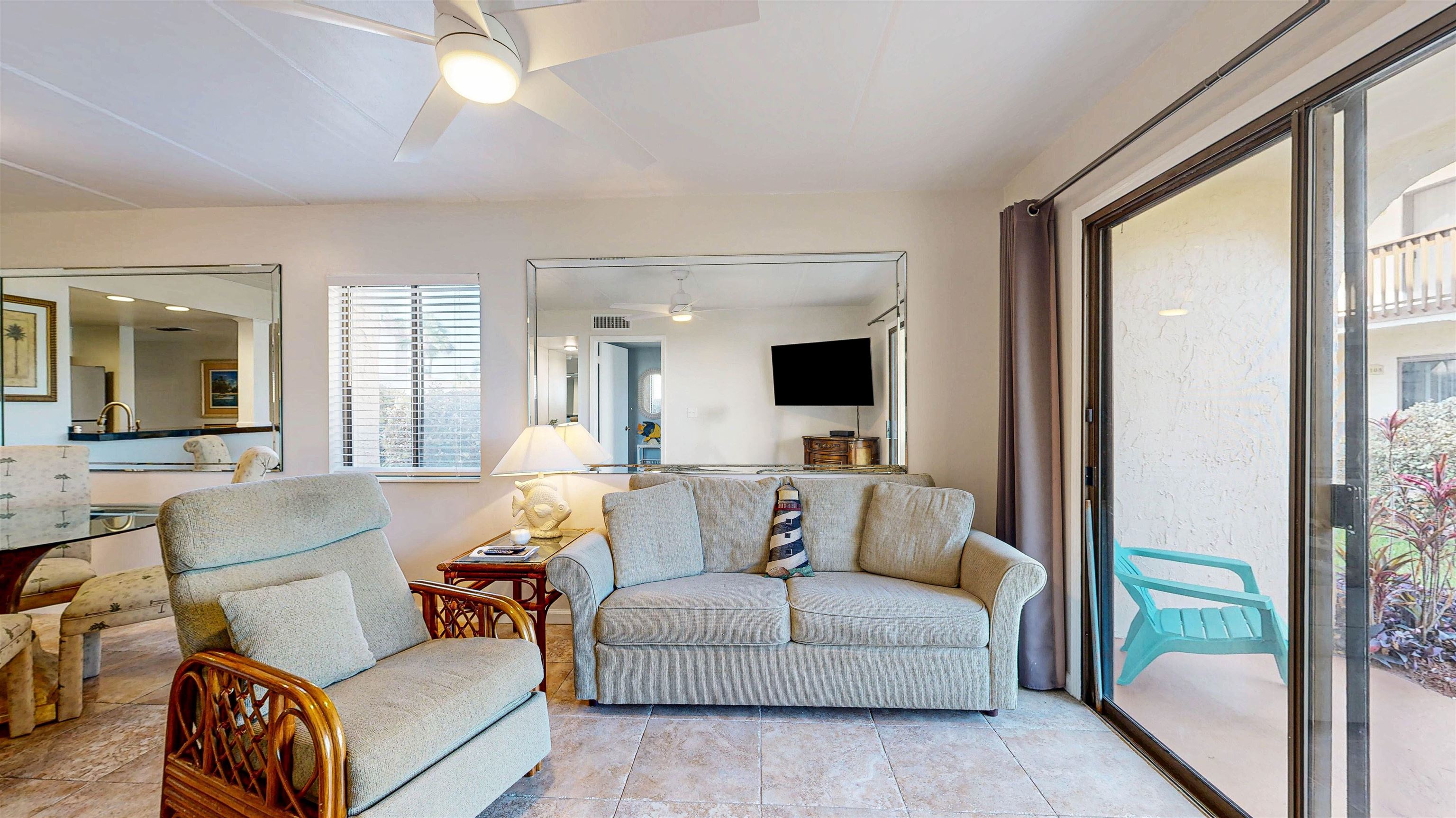 880 A1A Beach Boulevard, Unit 6101 St. Augustine, FL 32080 - Photo 5 of 21 a living room with furniture and a flat screen tv