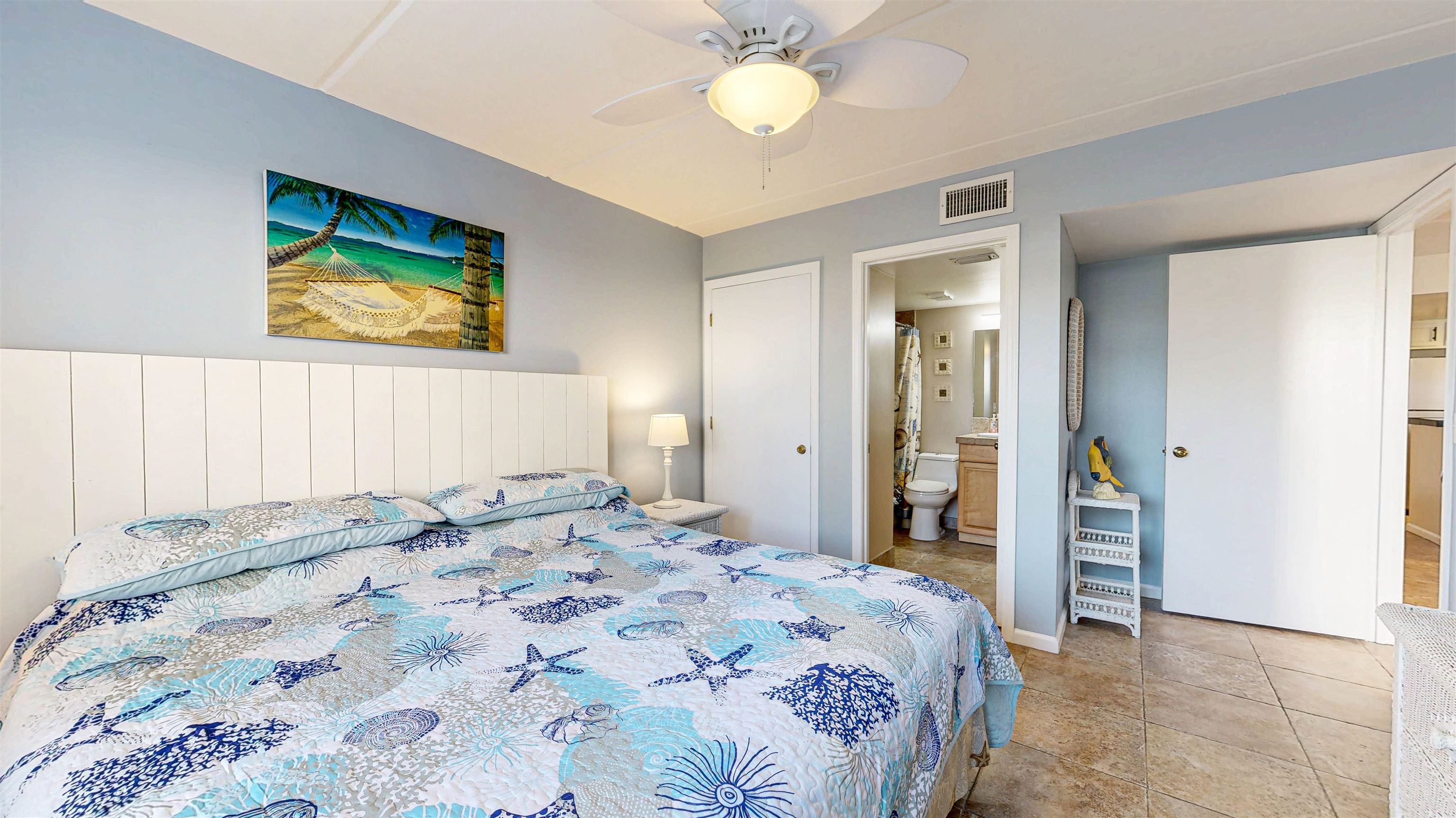 880 A1A Beach Boulevard, Unit 6101 St. Augustine, FL 32080 - Photo 7 of 21 a bedroom with a bed and a chandelier