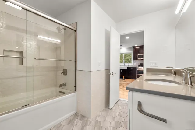 a view of backyard with wooden floor and fence