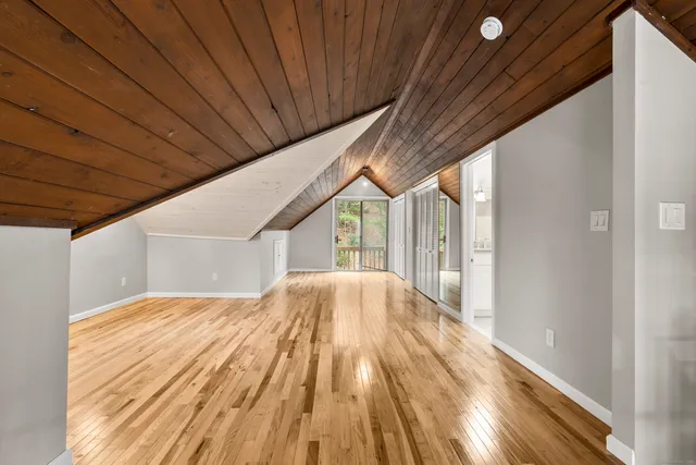 a view of balcony with wooden floor