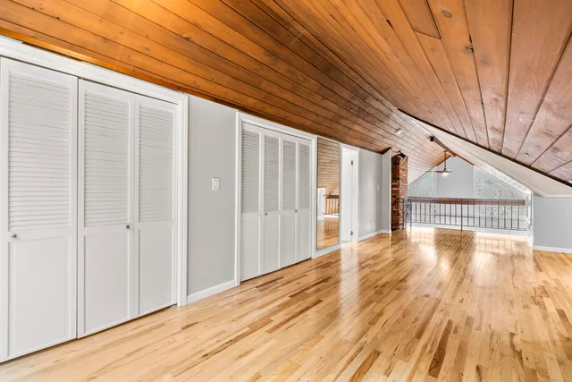 a bathroom with a double vanity sink a toilet and a mirror