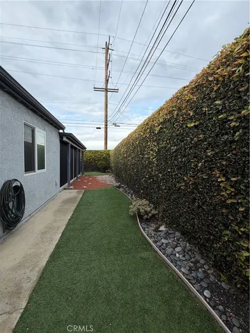 a backyard of a house with lots of green space