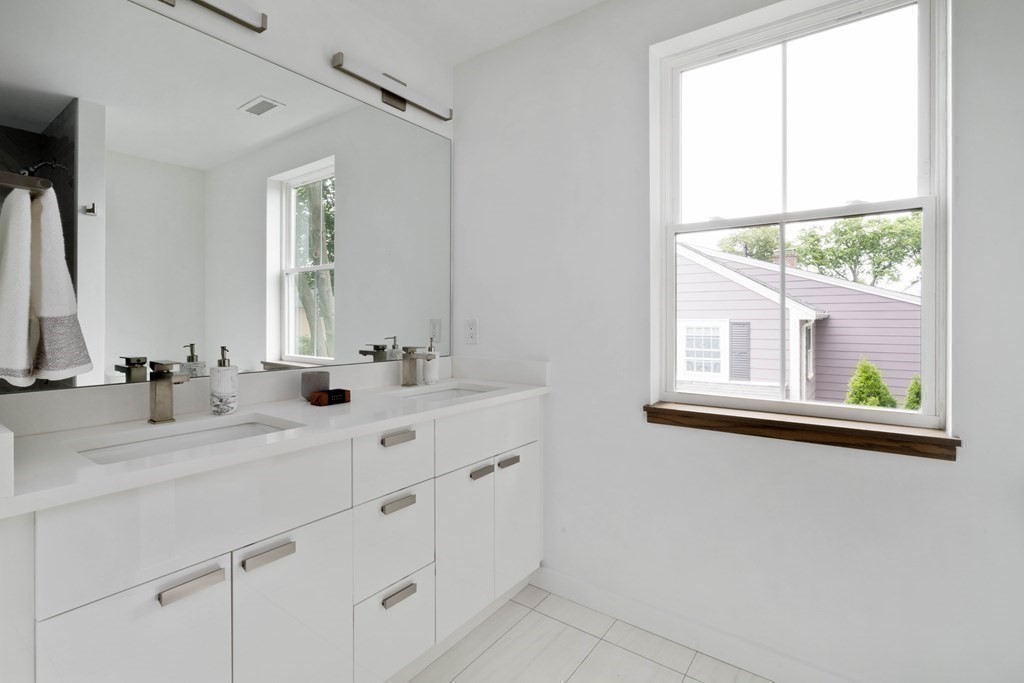 51 Eliot Road Arlington, MA 02474 - Photo 19 of 42 a bathroom with 2 sink and a mirror