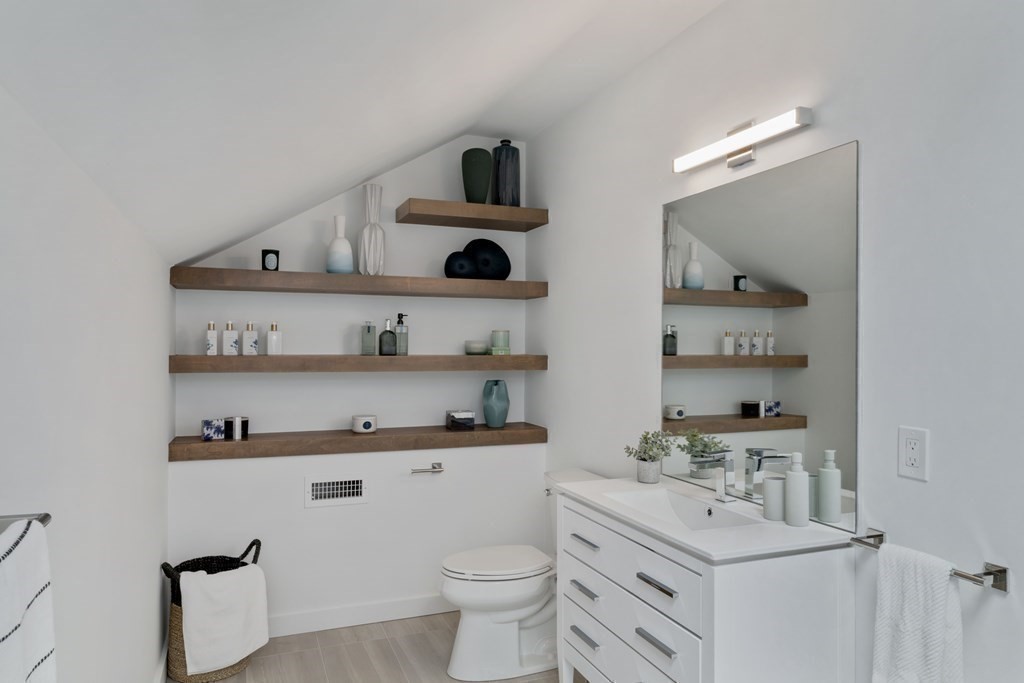 51 Eliot Road Arlington, MA 02474 - Photo 20 of 42 a kitchen with a sink a stove and cabinets