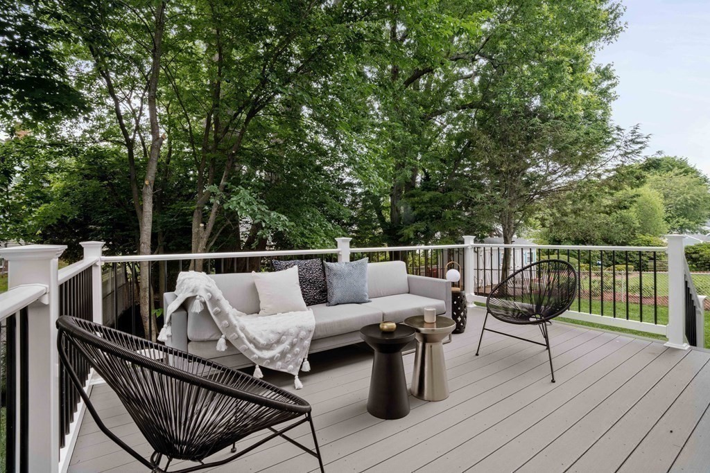 51 Eliot Road Arlington, MA 02474 - Photo 22 of 42 a roof deck with couches and wooden floor