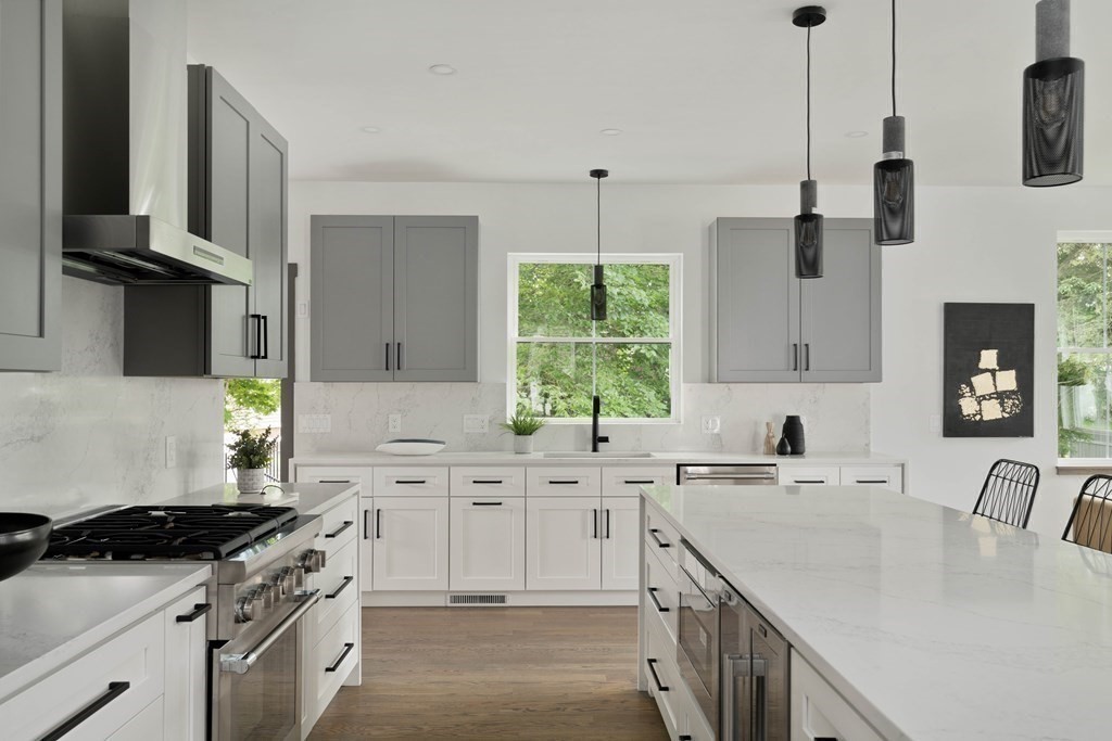 51 Eliot Road Arlington, MA 02474 - Photo 25 of 42 a kitchen with a sink stove and cabinets