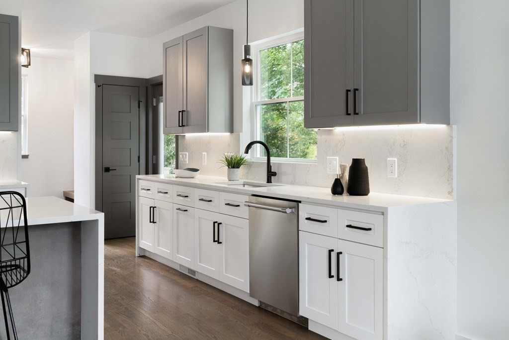 51 Eliot Road Arlington, MA 02474 - Photo 27 of 42 a kitchen with white cabinets and sink