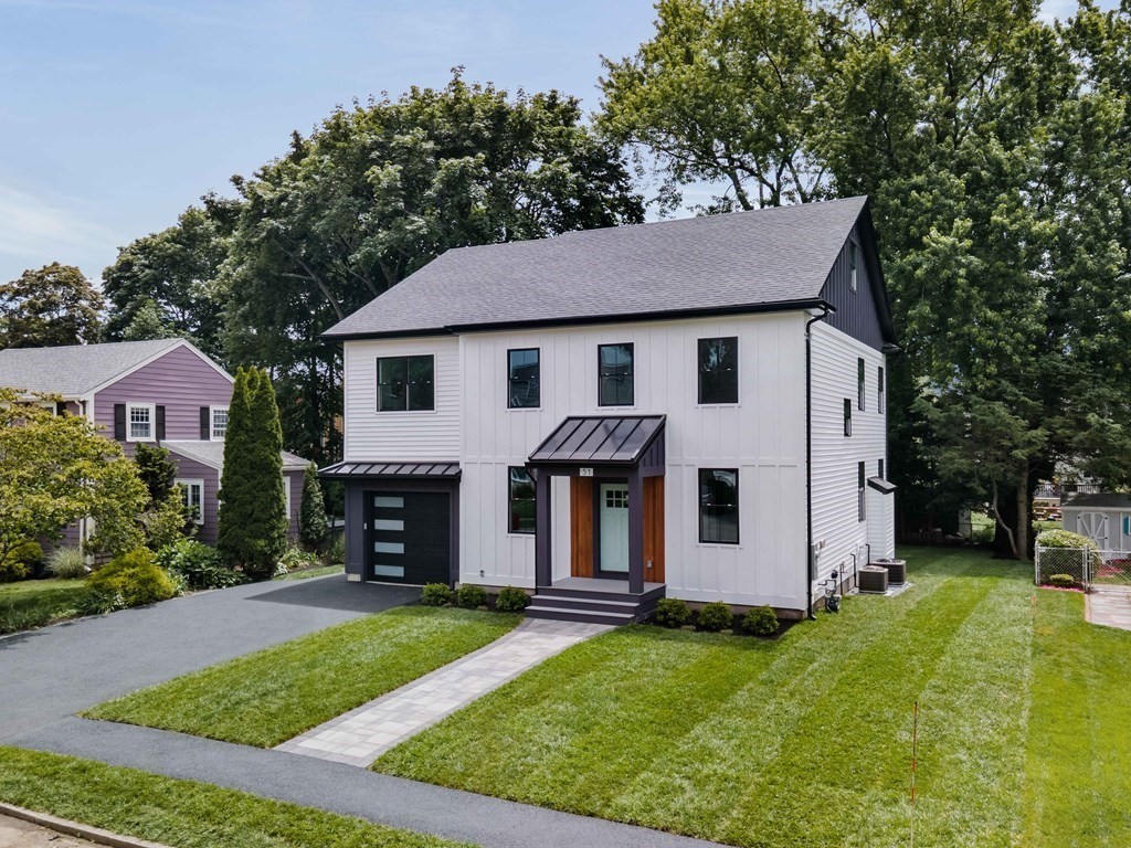 51 Eliot Road Arlington, MA 02474 - Photo 3 of 42 front view of a house with a yard