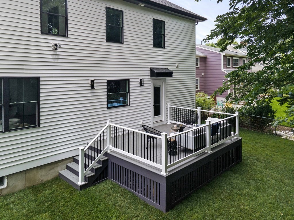 51 Eliot Road Arlington, MA 02474 - Photo 32 of 42 a view of a house with a yard and a deck