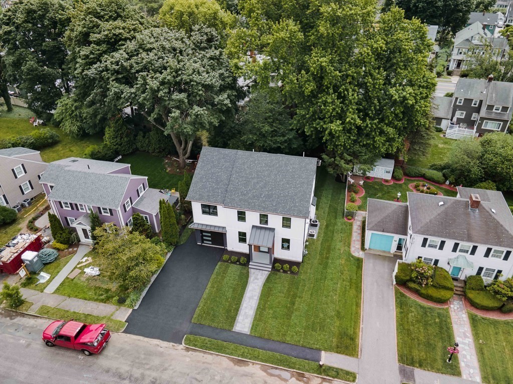 51 Eliot Road Arlington, MA 02474 - Photo 36 of 42 an aerial view of a house with a garden and trees