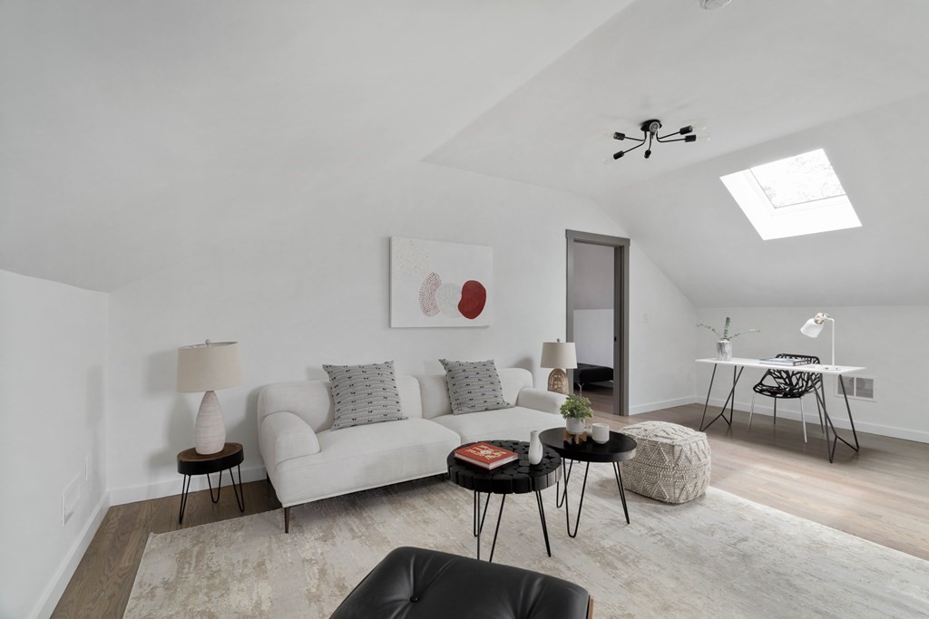 51 Eliot Road Arlington, MA 02474 - Photo 42 of 42 a living room with furniture and a wooden floor