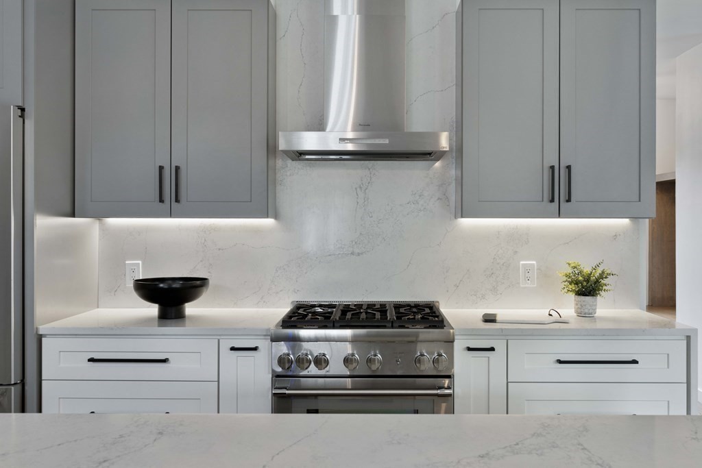 51 Eliot Road Arlington, MA 02474 - Photo 6 of 42 a kitchen with a stove and cabinets