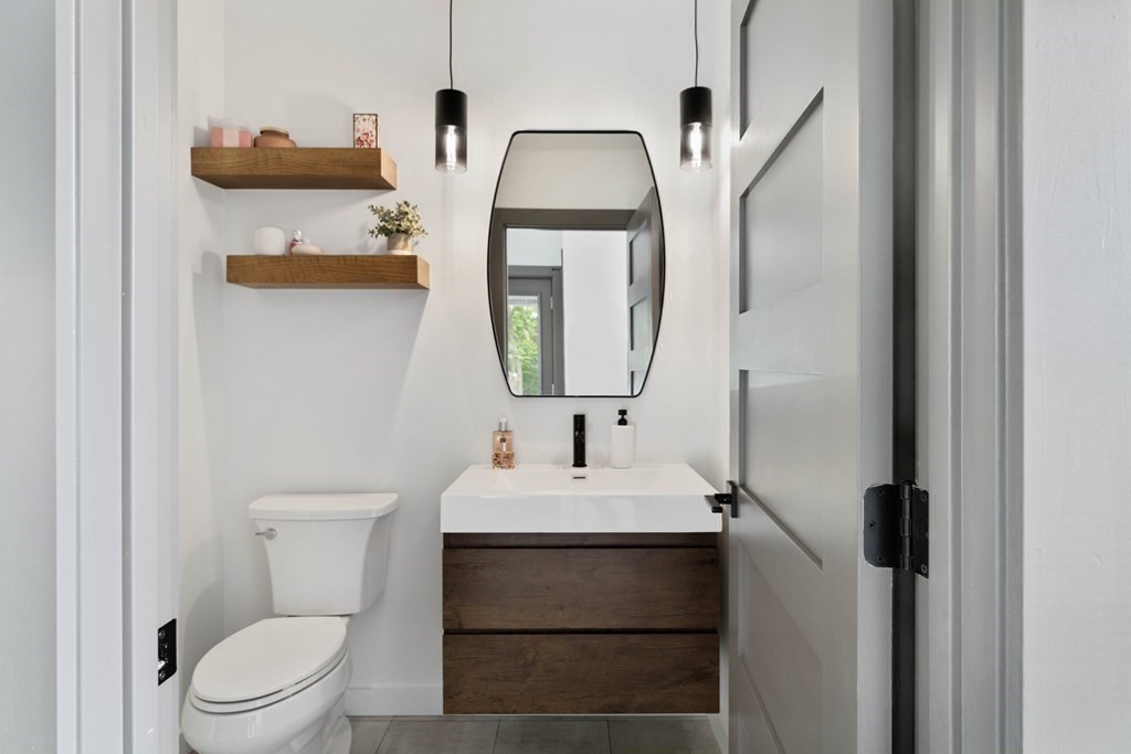 51 Eliot Road Arlington, MA 02474 - Photo 10 of 42 a bathroom with a toilet sink and mirror