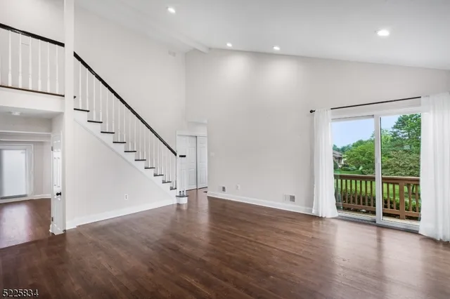 a view of entryway with wooden floor