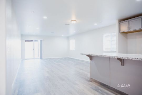 929 South Farragut Street Ridgecrest, CA 93555 - Photo 11 of 35 wooden floor in an empty room